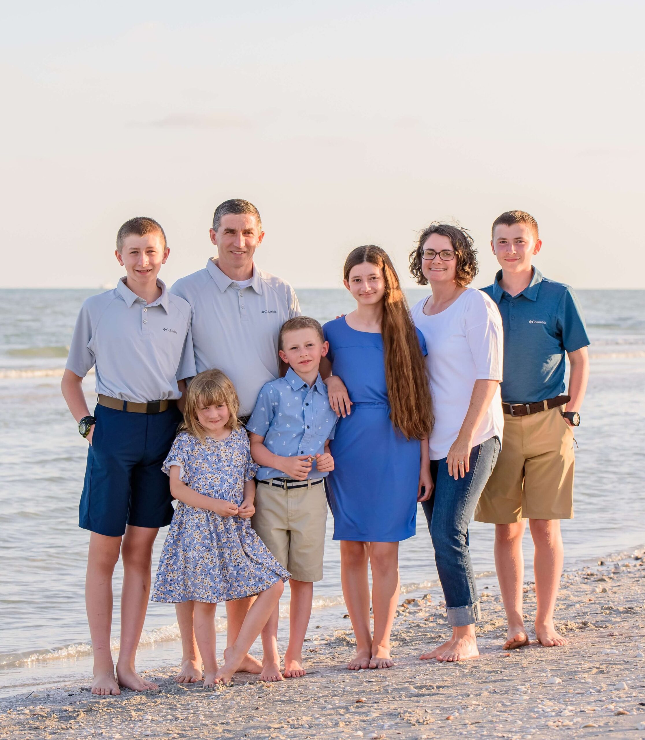 Photo of founder Ryan with his family on the beach